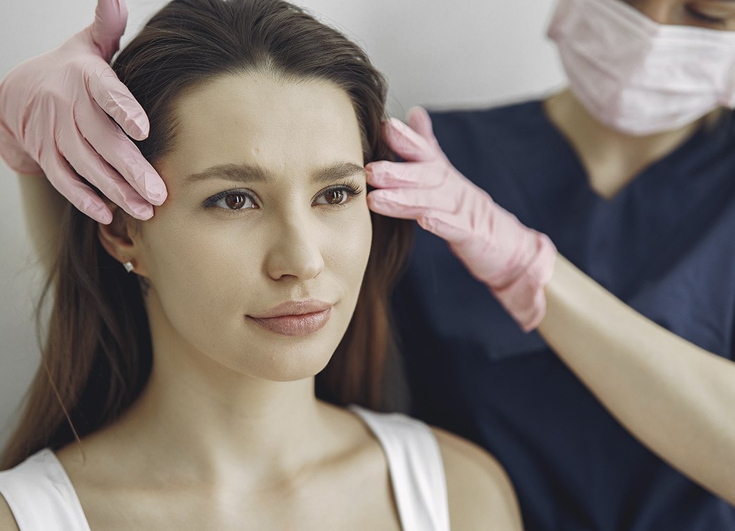 Plastic Surgeon Demonstrating Potential Facelift Changes